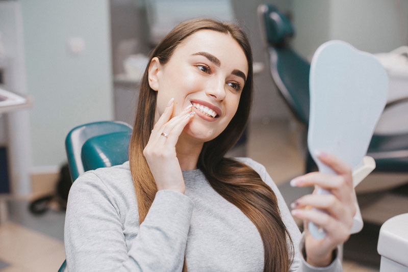 dental patient smiling after orthodontics procedure